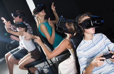 Son watching  video with family in room of virtual reality