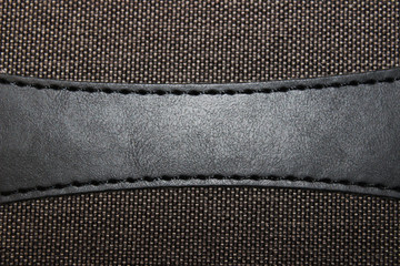 Fabric texture with leather insert background