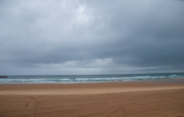 Lonely beach landscape with storm sky in northern Spain