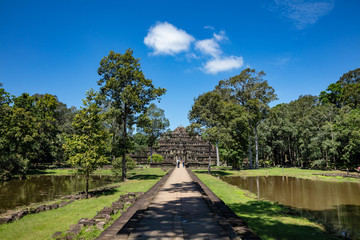 Fototapeta na wymiar Angkor Wat, Cambodia September 6th 2018 : Tourists walking towards the famous Baphuon temple at Angkor Thom, Siem Reap, Cambodia