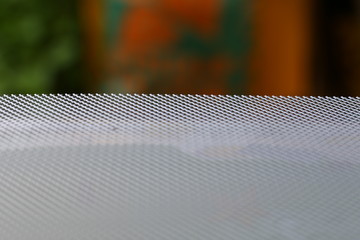 Metal mesh as a structure and background with different orientation and background color.