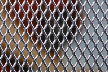 Fototapeta premium Metal mesh as a structure and background with different orientation and background color.