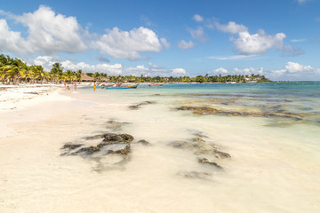 People relaxing at Akumal Public Beach, Mexico. Beach in Cancun on the Yucatan Peninsula