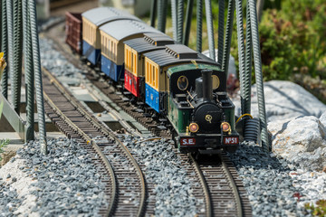 Railway modelling train outdoors on a sunny day
