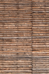 Fragment of the log wall. The texture of the wooden wall of logs