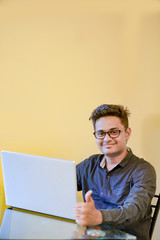  Young indian man with laptop