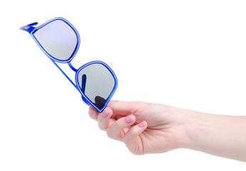 Blue sunglasses in hand on white background isolation