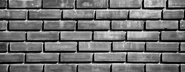 closeup black brick wall for background  - monochrome
