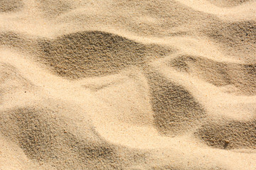 closeup sand pattern of a beach in the summer
