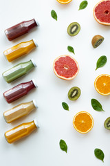 Juices and different fruits on white background. Healthy and fresh concept.