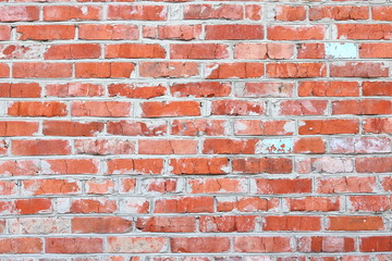 Obraz premium wall of bright old red brick as beautiful loft-style background for modern interior design and exterior of industrial premises, apartments and houses