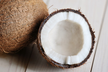 half-broken coconut on wooden