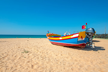 Fishers boat on the beach in Armacao de Pera in the Algarve Portugal