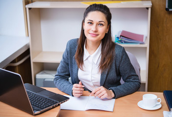 a teacher sitting at the desk