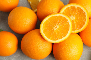 Ripe oranges on grey table, closeup. Citrus food