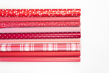 Red and White Gift Wrapping Paper Rolls in Variable Colors