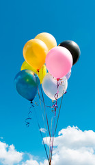 colored balloons against the sky