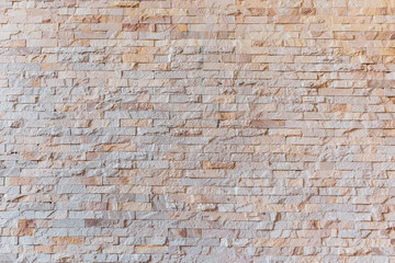 Background and texture stone cladding wall.