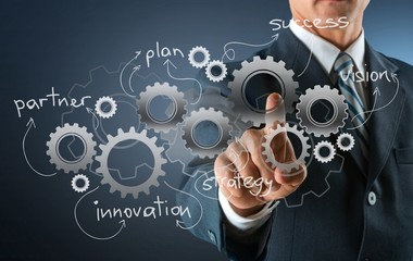 Businessman and  analytics symbols on  background