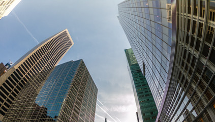 Fototapeta na wymiar Wide angle upward view of skyscrapers buildings in New York, USA