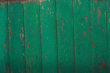 Background of green flaky wood Backdrop of green colored wooden panels with aged flaky surface