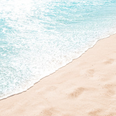 Blue ocean wave on sandy beach. Summer day and sand beach background