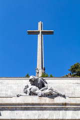 The passion of Christ statue and the big cross on the top of the Valley of the Fallen (Valle de Los Caidos), the burying place of the Dictator Franco on the Sierra the Guadarrama, Madrid, Spain