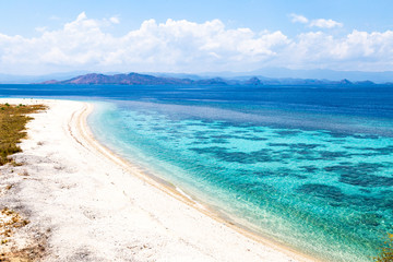 Crystal clear water in Sabolon Besar island, one of the many island paradise spots for diving in the protected area of Komodo National Park, Lubuan Bajo, Nusa Tenggara, Flores, Indonesia