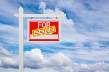 Sold For Sale Real Estate Sign over Clouds and Blue Sky. 3d Illustration