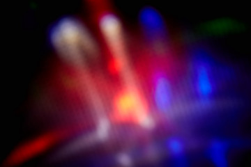 Multicolored spots of light, continuously replacing each other