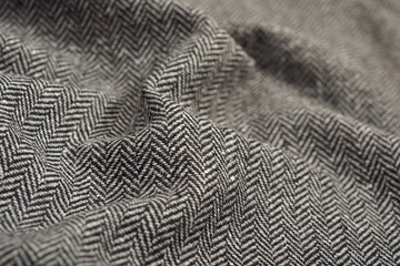 Draped herringbone tweed wool fabric texture - obrazy, fototapety, plakaty