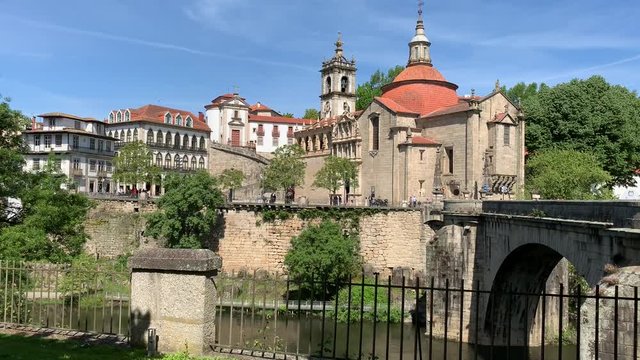 Beautiful view of the San Goncalo church and bridge on a clear day in spring