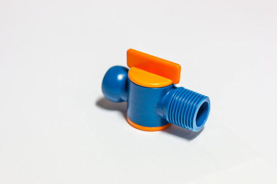 Plastic tap for water on a white background.