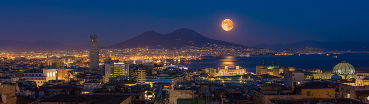 Full moon rises above Mount Vesuvius, Naples and Bay of Naples, Italy