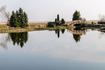 Fototapeta premium Biebrza Valley (Poland). Small pond in Goniadz town at dusk