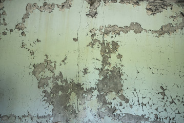 Flaking paint on the wall in abandoned building in Pripyat ghost city, Chernobyl Exclusion Zone, Ukraine