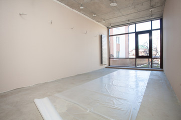 Waterproofing. Empty room. Floor repair in private apartment. Moving to a new home. Interior...