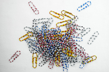 Group of colourful paper clip on white background