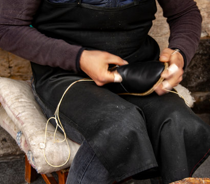 Cropped image of young  traditional shoemaker making shoes at Gaziantep, Turkey.