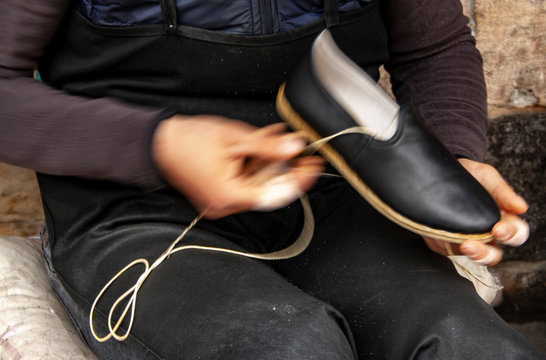 Cropped image of young  traditional shoemaker making shoes at Gaziantep, Turkey.
