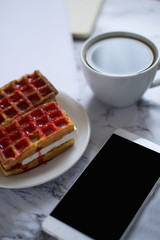 Business lunch: smartphone, dessert, diary on marble background