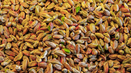 Close up picture of organic peeled pistachio.
