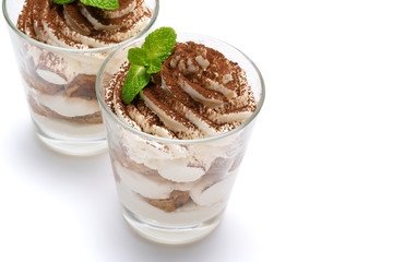 two portions Classic tiramisu dessert in a glass isolated on a white background with clipping path