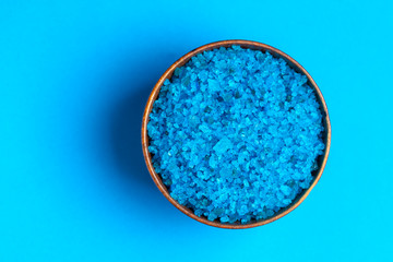 Blue bath salt on blue background
