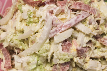 Delicious and appetizing salad of Chinese cabbage, sausage, eggs and sauce