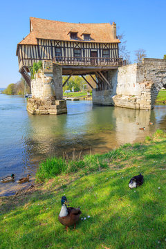 Old mill on bridge Seine river, Vernon, Normandy, France