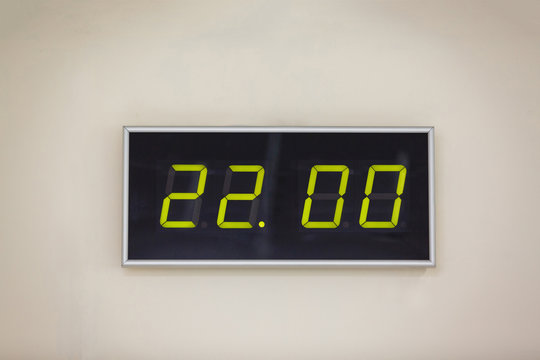 Black digital clock on a white background showing time 22.00