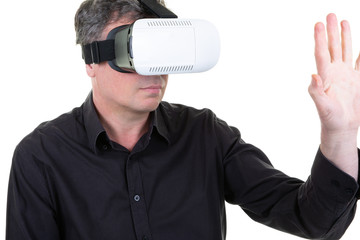 man standing with vr virtual glasses on white background hand raised in front of him