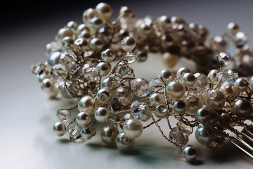 Close up of pearl beads isolated on white background. Hair accessory.