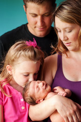 Family Holding Newborn Baby